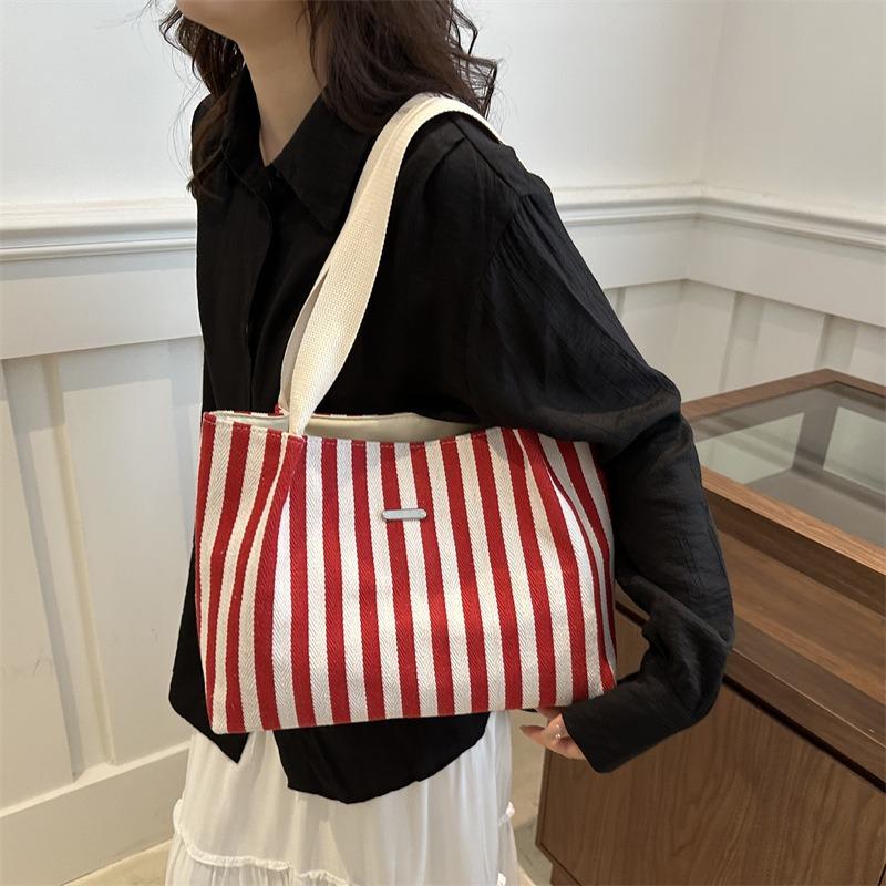 Korean version of retro literary and simple small fresh stripes casual fashion foreign style large capacity shoulder portable tote women's bag
