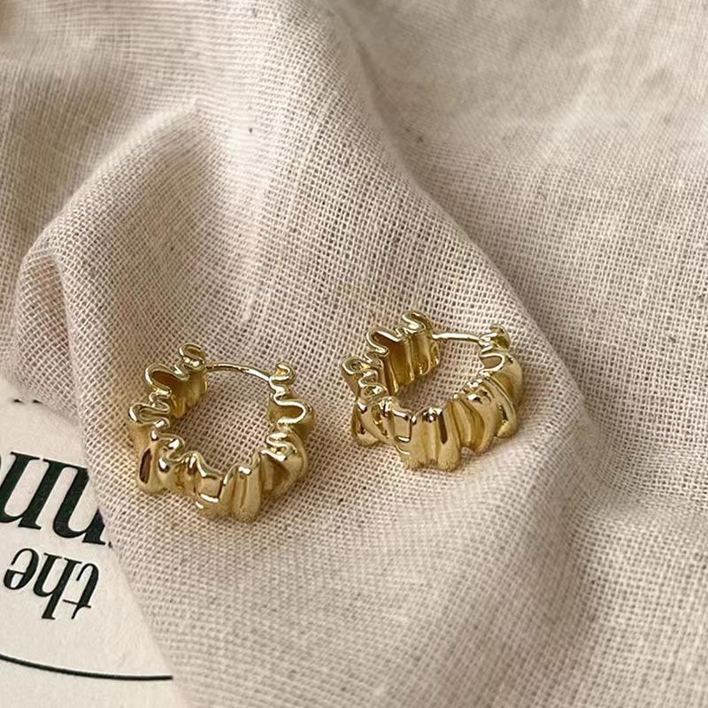 

Niche high-end sense irregular metal stud earrings women s year new trendy cold wind earrings versatile earrings