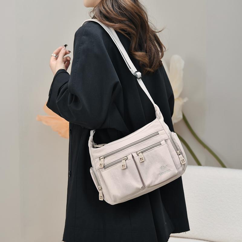 Fashionable Multi Pocket Crossbody Bag with Adjustable Strap and Spacious Design for Daily Use