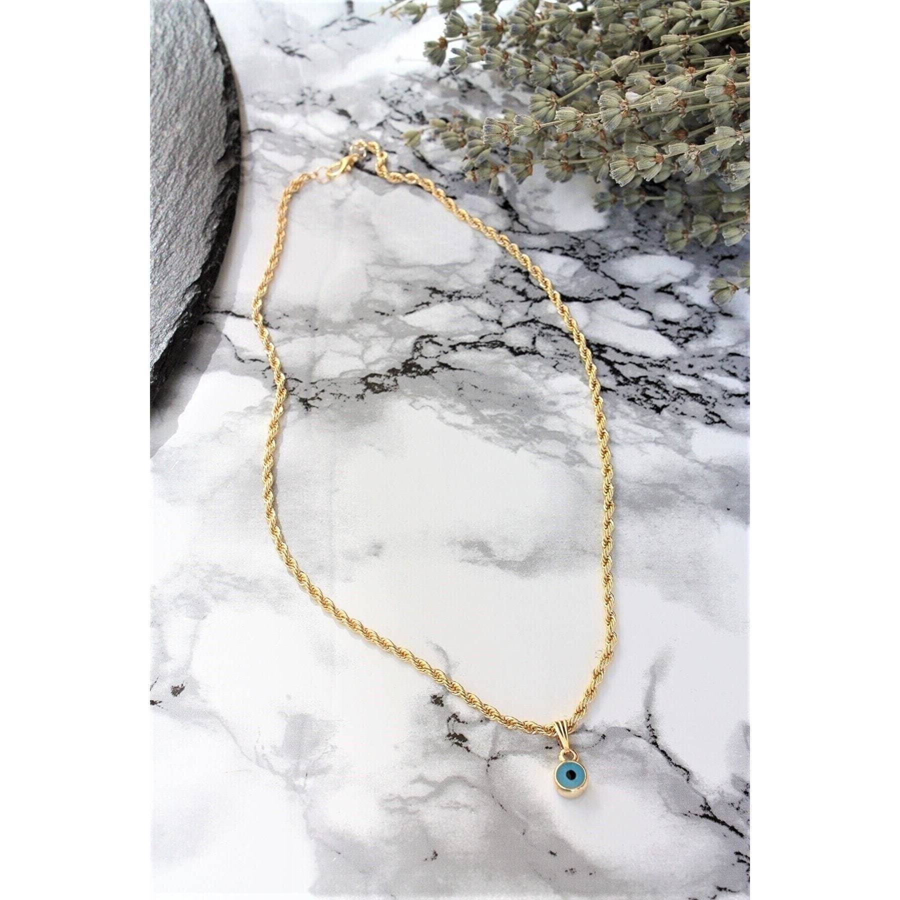 

Женское ожерелье с витой цепью и бусинами сглаза