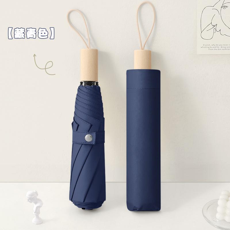 New three-fold simple plain color windproof and sun protection creative solid wood handle female vinyl parasol