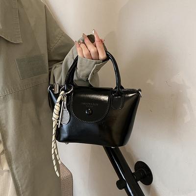 Popularna moda prosta wysoka jakość przenośna mała torba wiatr dojeżdżający wszechstronna niszowa torba na ramię listonoszka