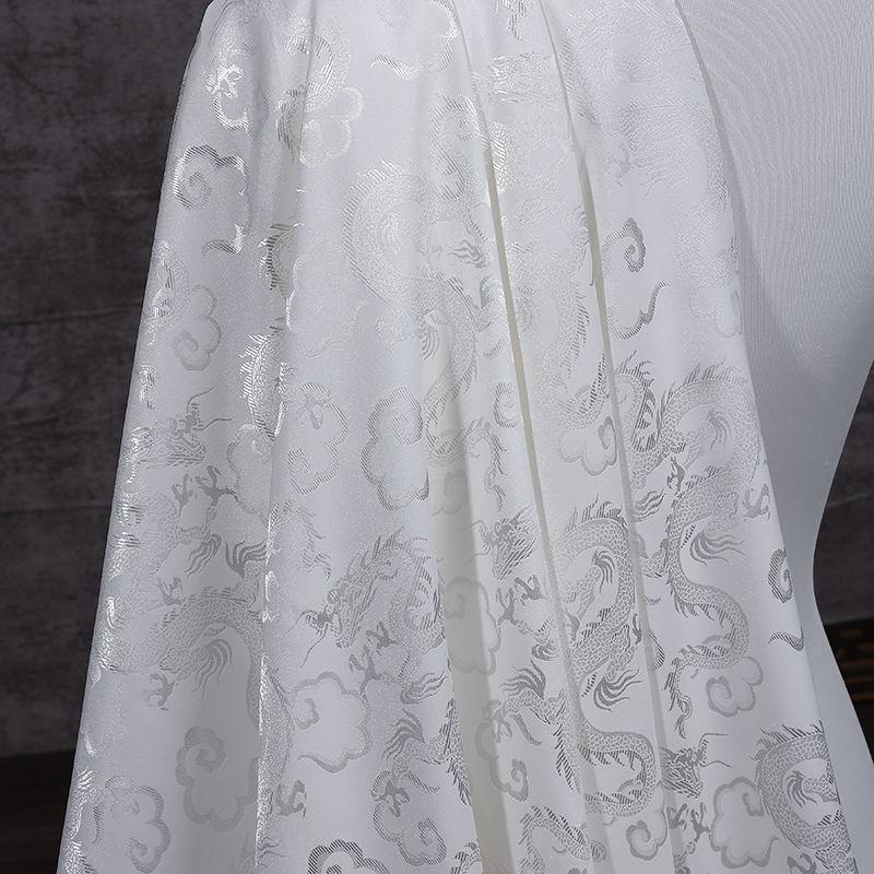 High-end dragon-patterned jacquard satin fabric suitable for wedding dresses formal gowns and designer clothing fabrics