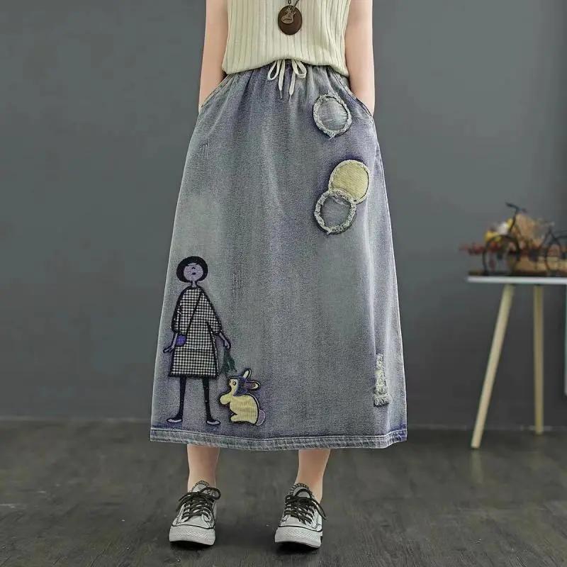 

Women s Autumn Light Blue Cartoon Patch Denim Midi Skirt L світло-синій колір