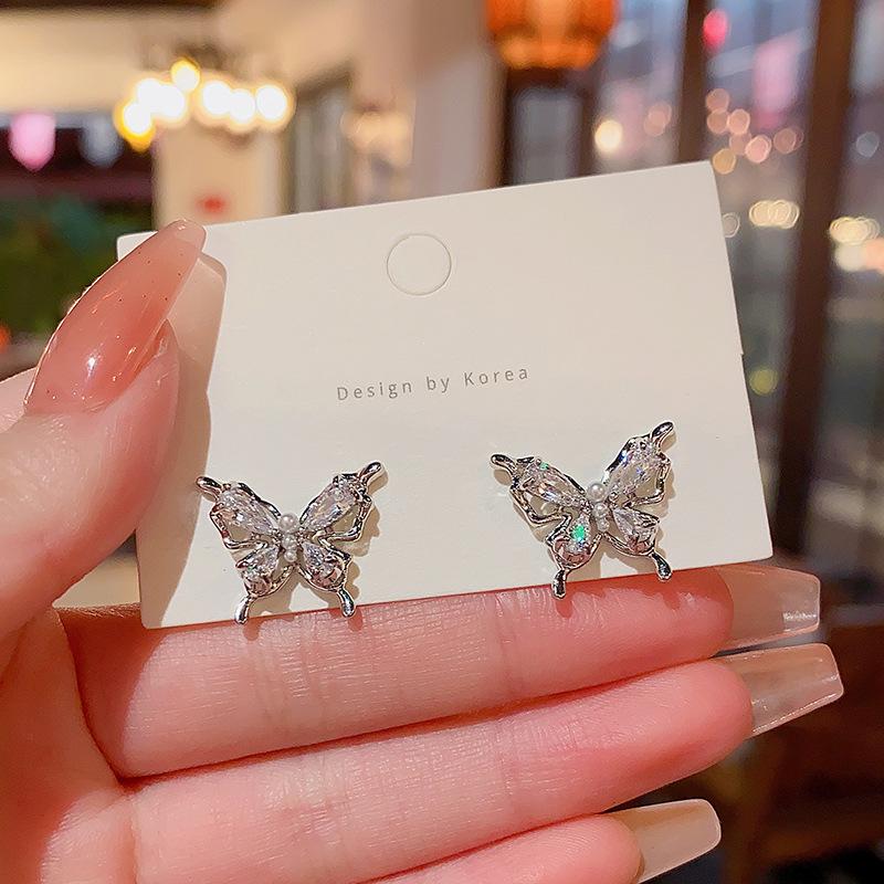 

Изысканные серьги-бабочки из серебра S925 с цирконами и полым танцующим дизайном для женщин