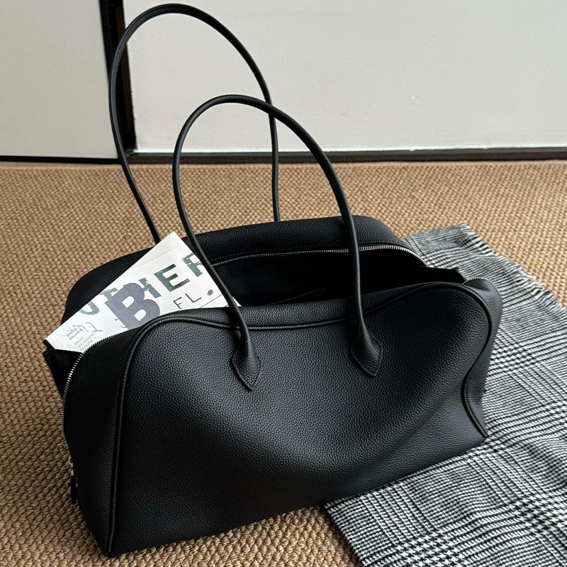 Schwarze weiche Leder-Tote-Bag mit großem Fassungsvermögen für Damen, leichter Luxus, Nische, High-End-Umhängetasche