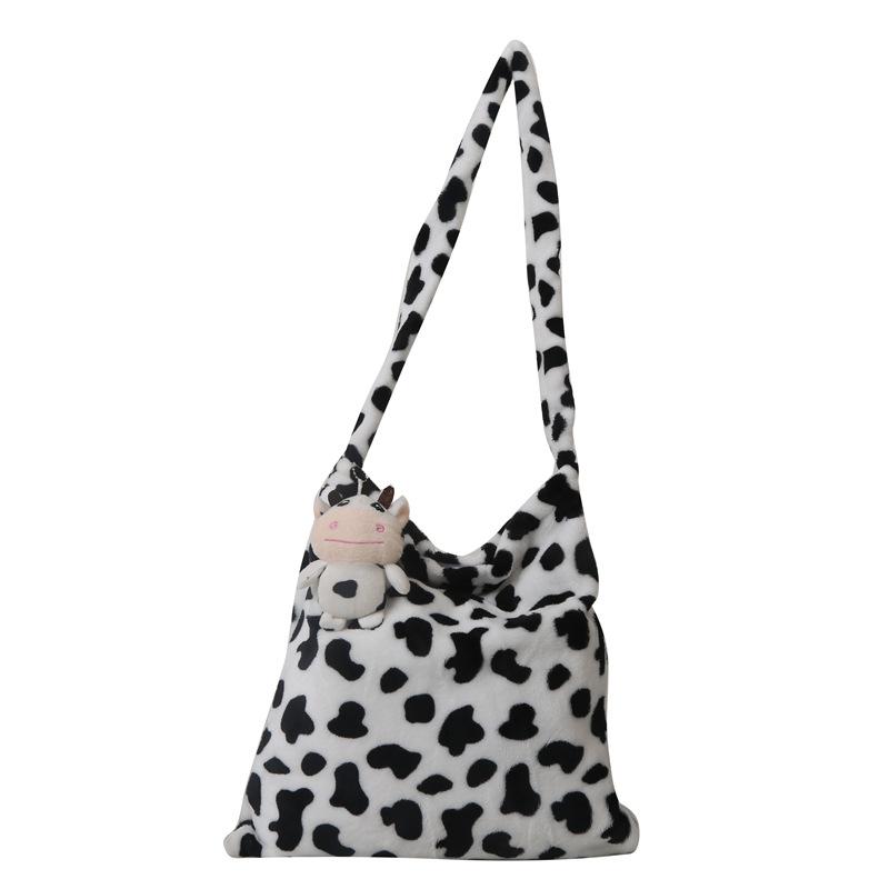 2025 Early Spring New Large Capacity Plush Trend Cow Pattern Personality Student Class Shoulder Bag Female Design Sense