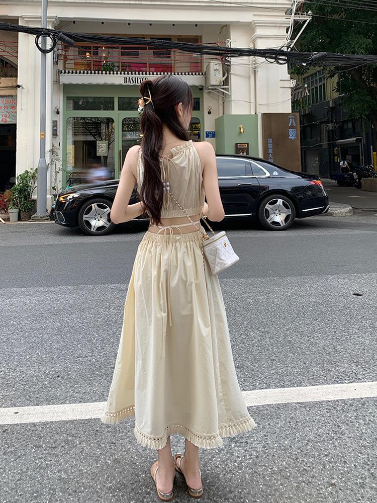 French hollow waist hanging neck suspender dress women's summer lace-up waist thin holiday style seaside fringed long dress
