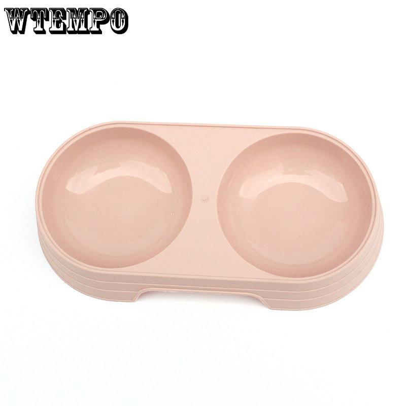 Zwierzęta domowe, koty i psy, piją i jedzą. Miska do ryżu podwójnego zastosowania. Artykuły dla zwierząt. Podwójna miska