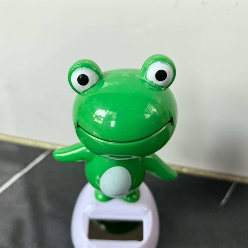 

Car Solar-Powered Swinging Frog Figurine: Light-Energy Shaking Head Ornament рожевий