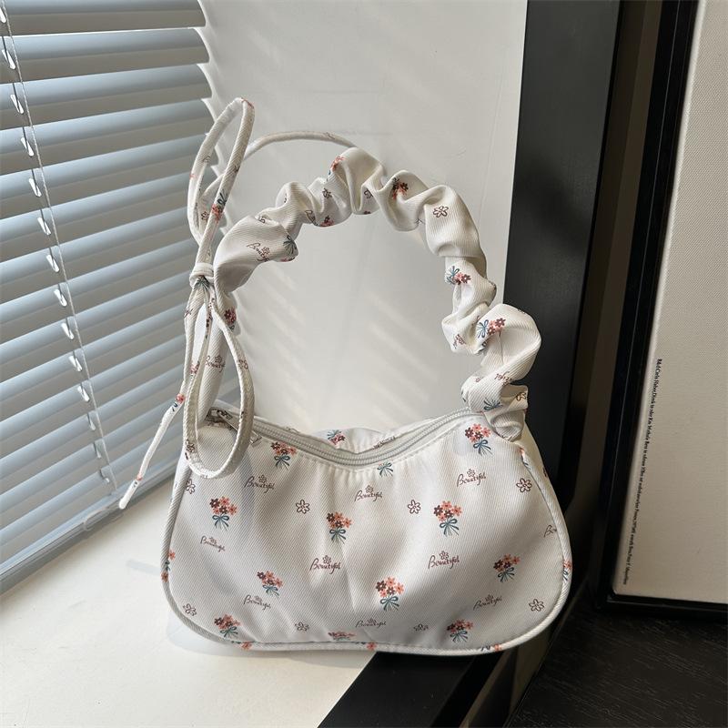 

Gentle and sweet flowers, beautiful and fresh women s bags, new drawstring shoulder bags, high-value handbags, underarm bags.
