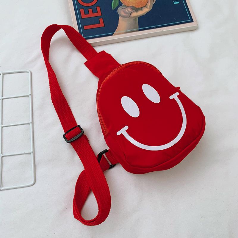 

Korean version of cute smiley face children s small breast bag kindergarten boys and girls cartoon messenger bag sports outdoor tide bag арбуз красный