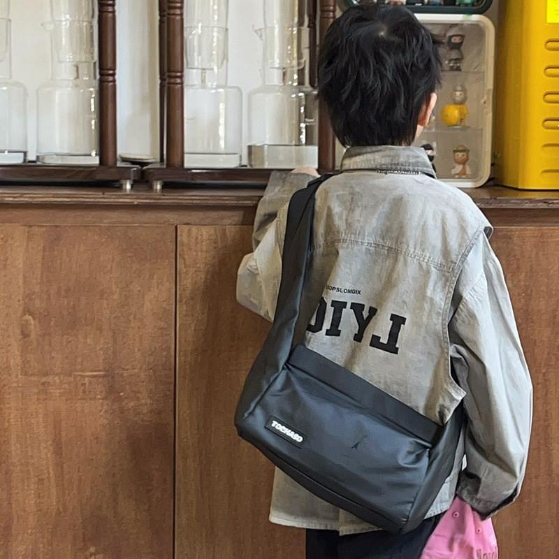 Lightweight Fashionable And Crossbody Bag For Kids Featuring Fun Letter Graphics And Modern Style