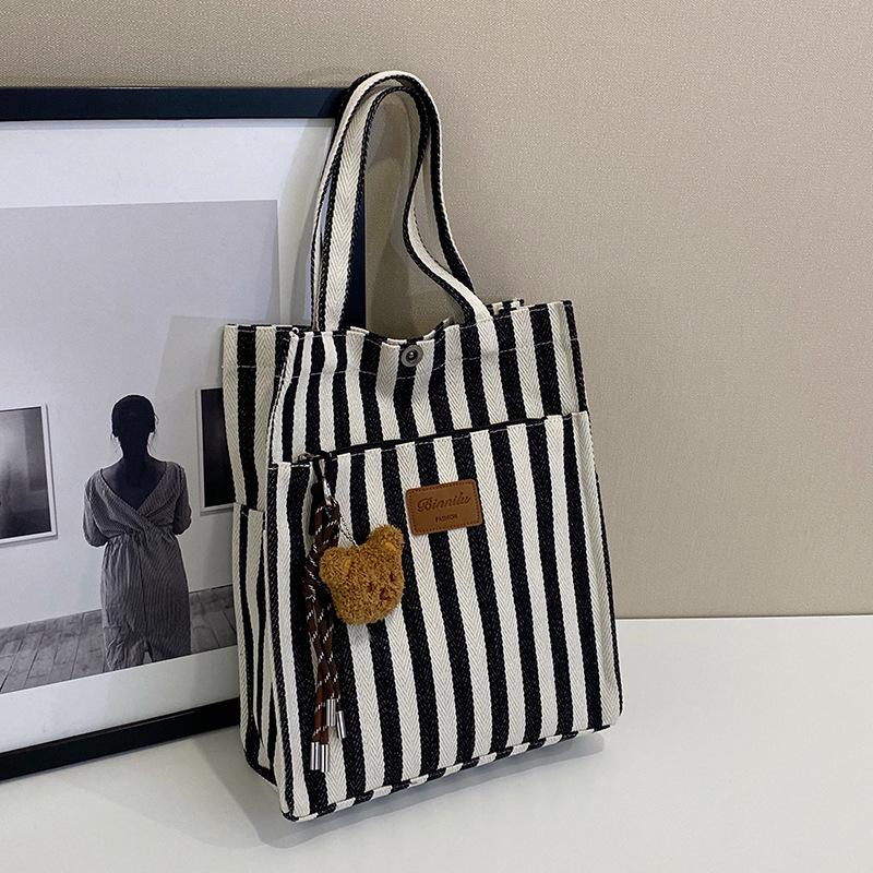 

Повседневная вместительная сумка-тоут через плечо, модная, популярная, холщовая, в полоску, 2025 новая, персонализированная no pendant чёрный