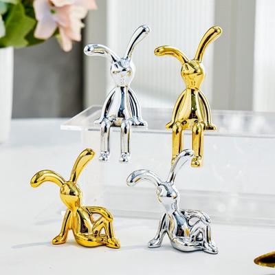 2 pezzi di figurine di coniglietto lungo orecchio adesivo galvanico UV seduto figura di coniglio modello statua giocattolo cruscotto dell'auto