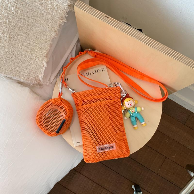 Sweet little fresh mobile phone bag women's 2025 summer new hollow shoulder bag crossbody mesh portable storage bag