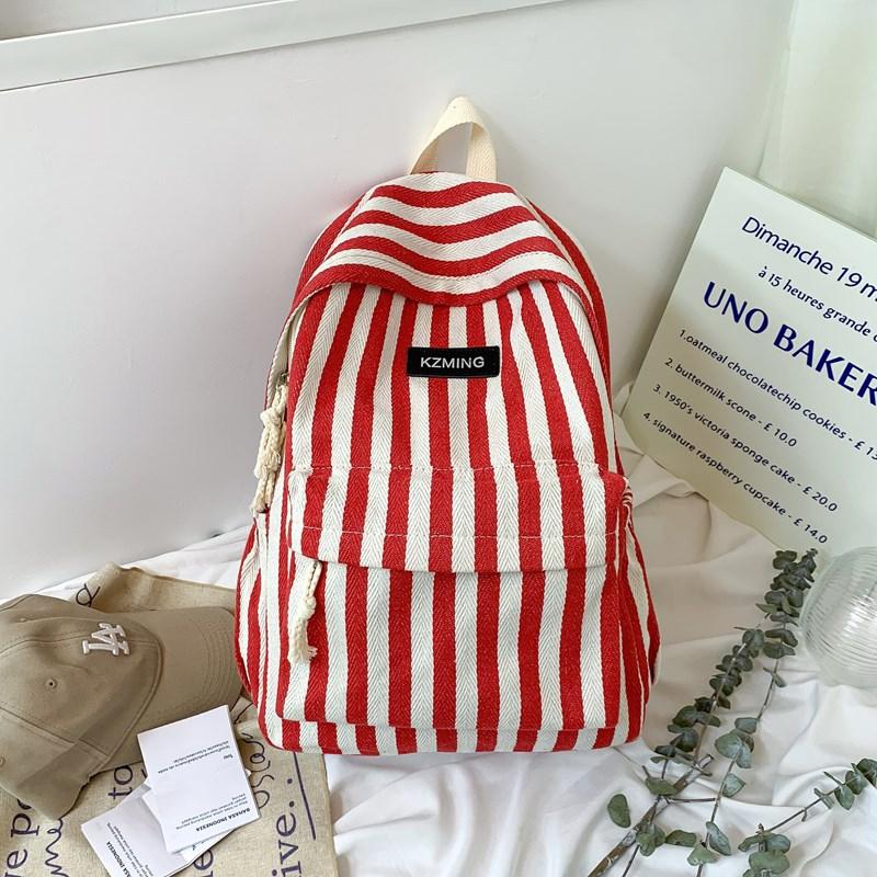 High-value college style striped backpack for junior high school students, casual, simple, lightweight and large-capacity backpack.