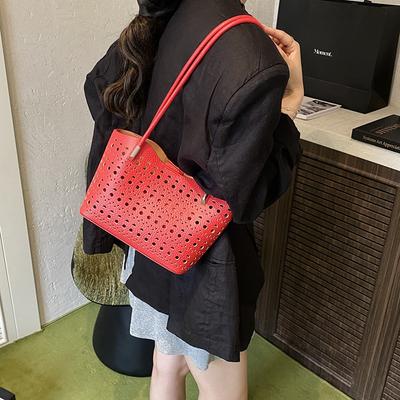 Hoogwaardige messenger bag dames veelzijdige grote capaciteit commuter tote bag dames niche ontwerp holle eenvoudige schoudertas