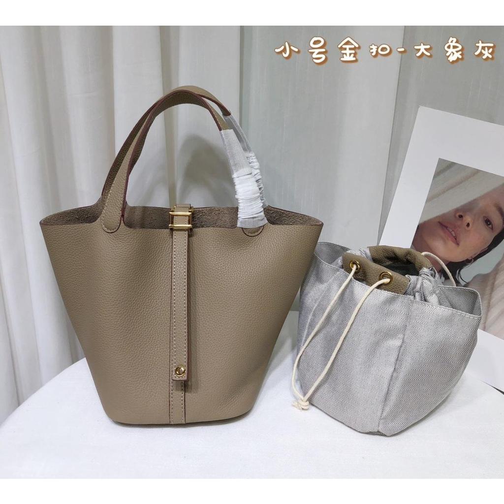 Spot wholesale top layer cowhide vegetable basket bag leather bucket bag commuter fashion lock buckle hand-held handbag woman