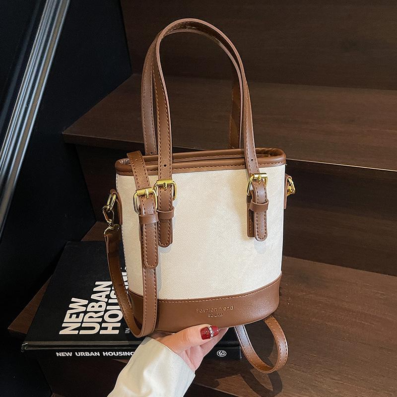 Geantă tip găleată cu design de nișă populară anul acesta, Stil nou de primăvară pentru femei, Geantă simplă pe un umăr și crossbody, Geantă de mână mică la modă