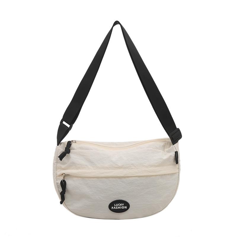 Japanese casual commuter messenger bag women s 2025 new solid color dumpling bag fashionable college student women s shoulder bag