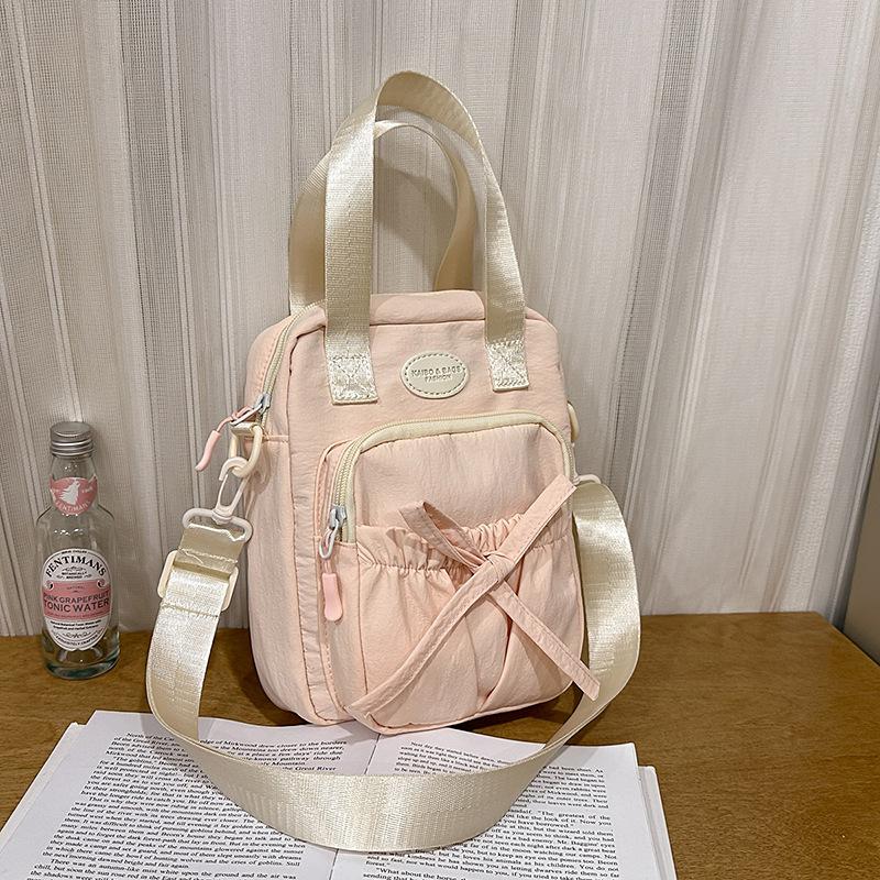 

Casual messenger bag new versatile fresh mobile phone bag college style student class shoulder bag розовый