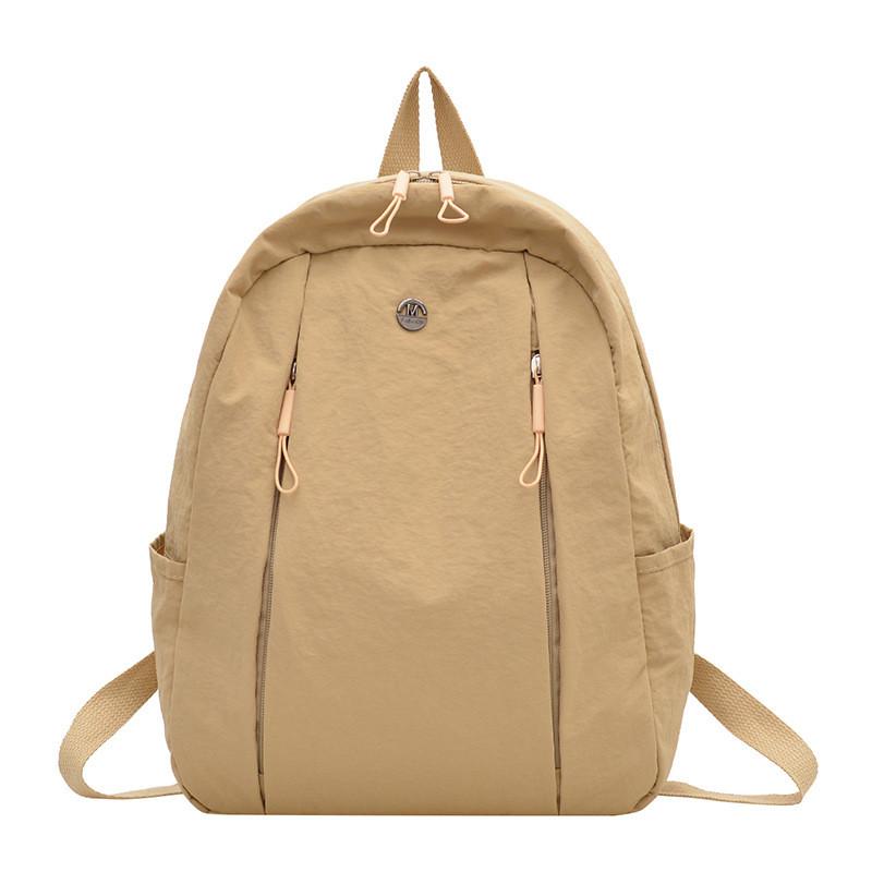 Lightweight Nylon Backpack For Commuting And Travel Withsmall Golden Roundel Decoration
