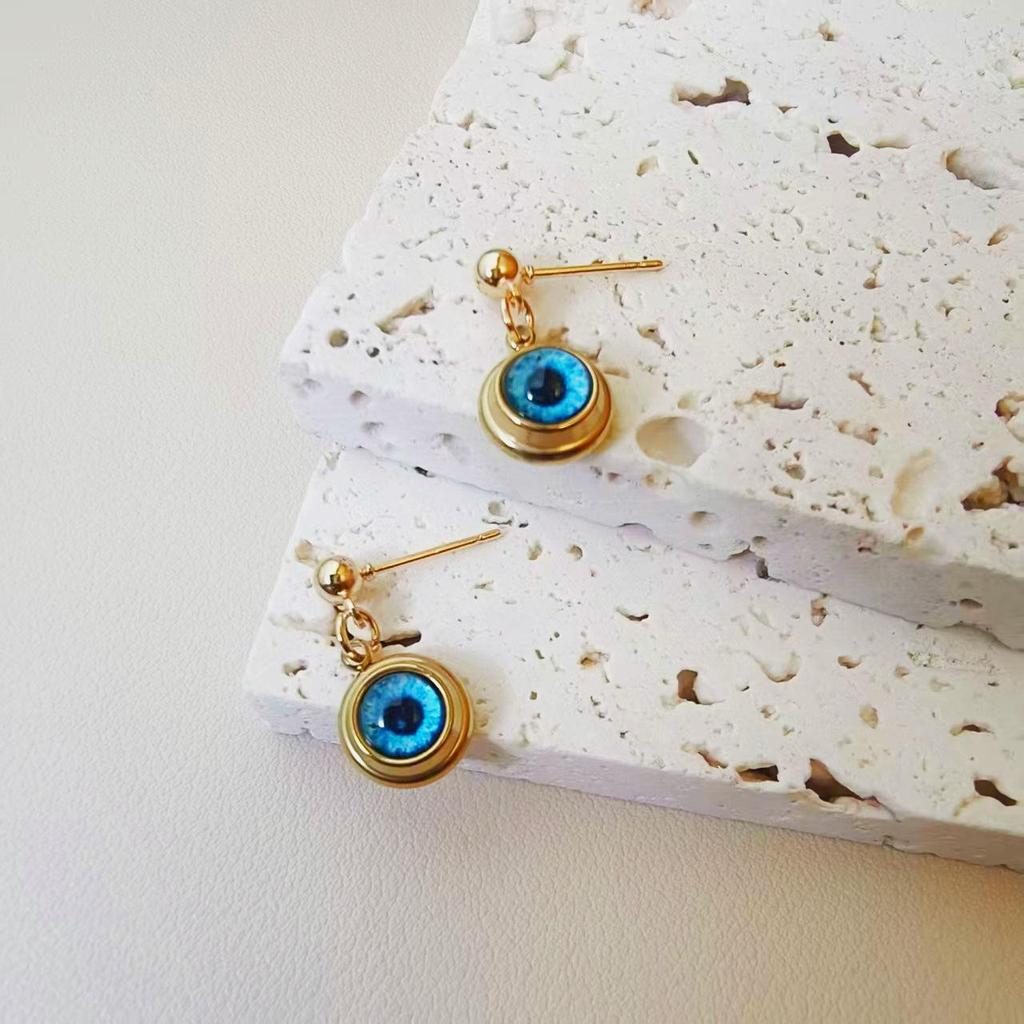 Squisito Set Collana e Orecchini in Acciaio di Titanio Placcato Oro con Design Occhio d'Angelo