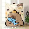 A Cute Capybara Holding a Fish, with an Orange Character On Its Head. for All Seasons Blanket Lunch Break Throw Gift