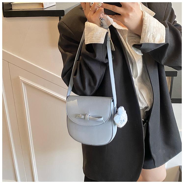 

Cute cartoon bow cat pendant student ins girl heart schoolbag 2025 spring new saddle bag tide