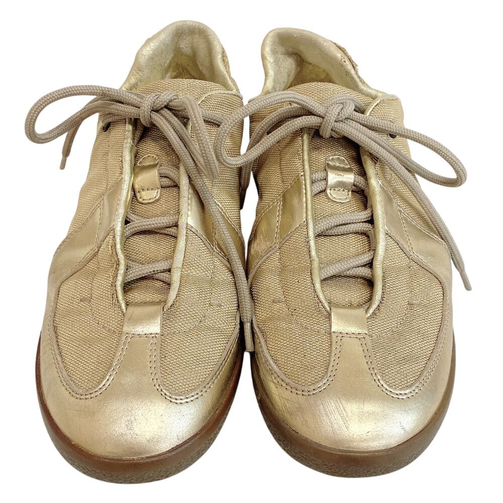 Gucci Niedrig geschnittene Leder-Sneaker goldfarbenes Leder Gebraucht