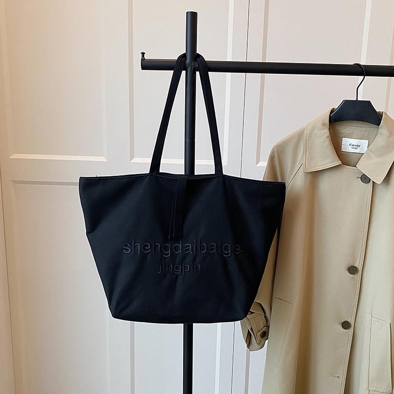 

Canvas large-capacity new versatile simple leisure single shoulder college student class commuter tote bag women чорний