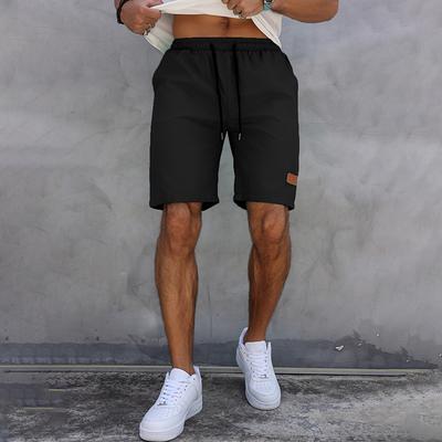Lässige Sommershorts für Herren, Fünfviertelhose, klassische, einfarbige Shorts mit Kordelzug und Lederetikett