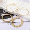 This 4-piece Gold Bracelet Set Features Vintage-style, Minimalist Chain Bracelets with a Mix-and-match Open Design for Layering.