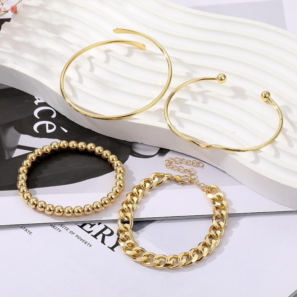 This 4-piece Gold Bracelet Set Features Vintage-style, Minimalist Chain Bracelets with a Mix-and-match Open Design for Layering.