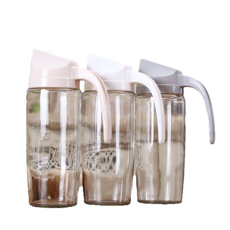 Automatic Open/Close Glass Oil Dispenser: Dustproof, Leakproof, Transparent Oil & Vinegar Bottle with Lid.
