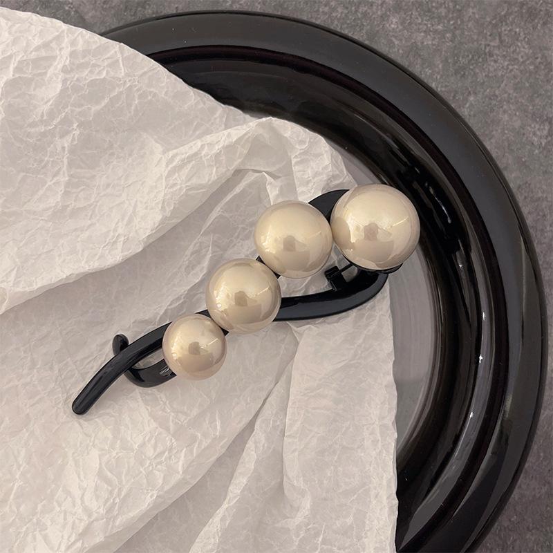 

2024 Корейська перлова шпилька для волосся: Елегантна шпилька-закрутка для жінок