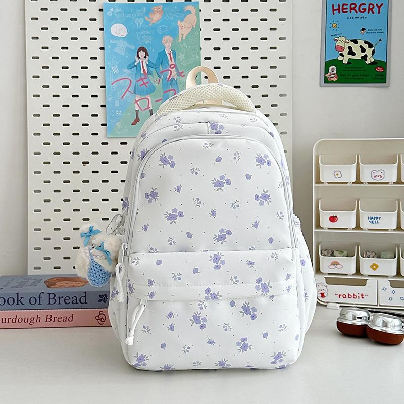 The new schoolbag is high-value, fresh and sweet floral backpack, and the lightweight spring outing backpack for junior high school students.