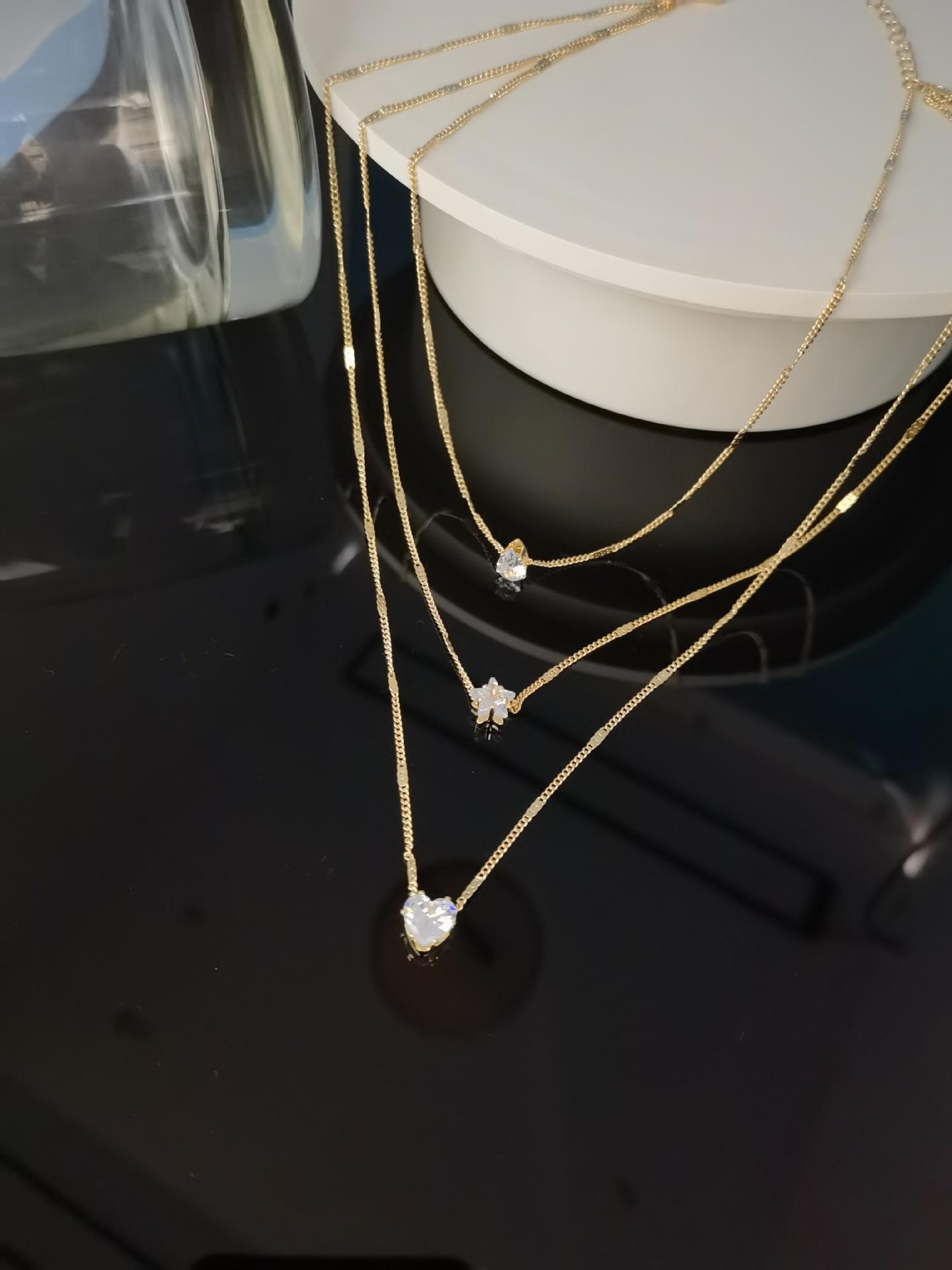 

Модне багатошарове намисто з підвісками у вигляді зірок та сердець