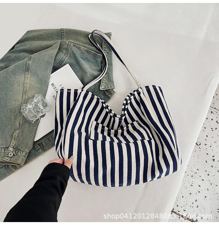 

Женская сумка-тоут 2025 новая корейская версия хозяйственная сумка повседневная универсальная холщовая сумка женская контрастная полосатая сумка через плечо большой вместимости
