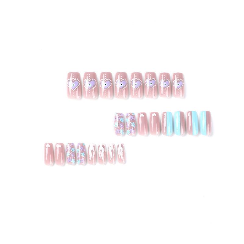 White Flame & Polka Dot Press-On Nails with Gold Glitter, Heart Designs, and Light Blue Flowers.