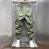 Men's Tapered Quick-Dry Elastic Cargo Pants with Drawstring, Multi-Pocket, Casual Trendy 9-Point Style for Spring and Autumn.