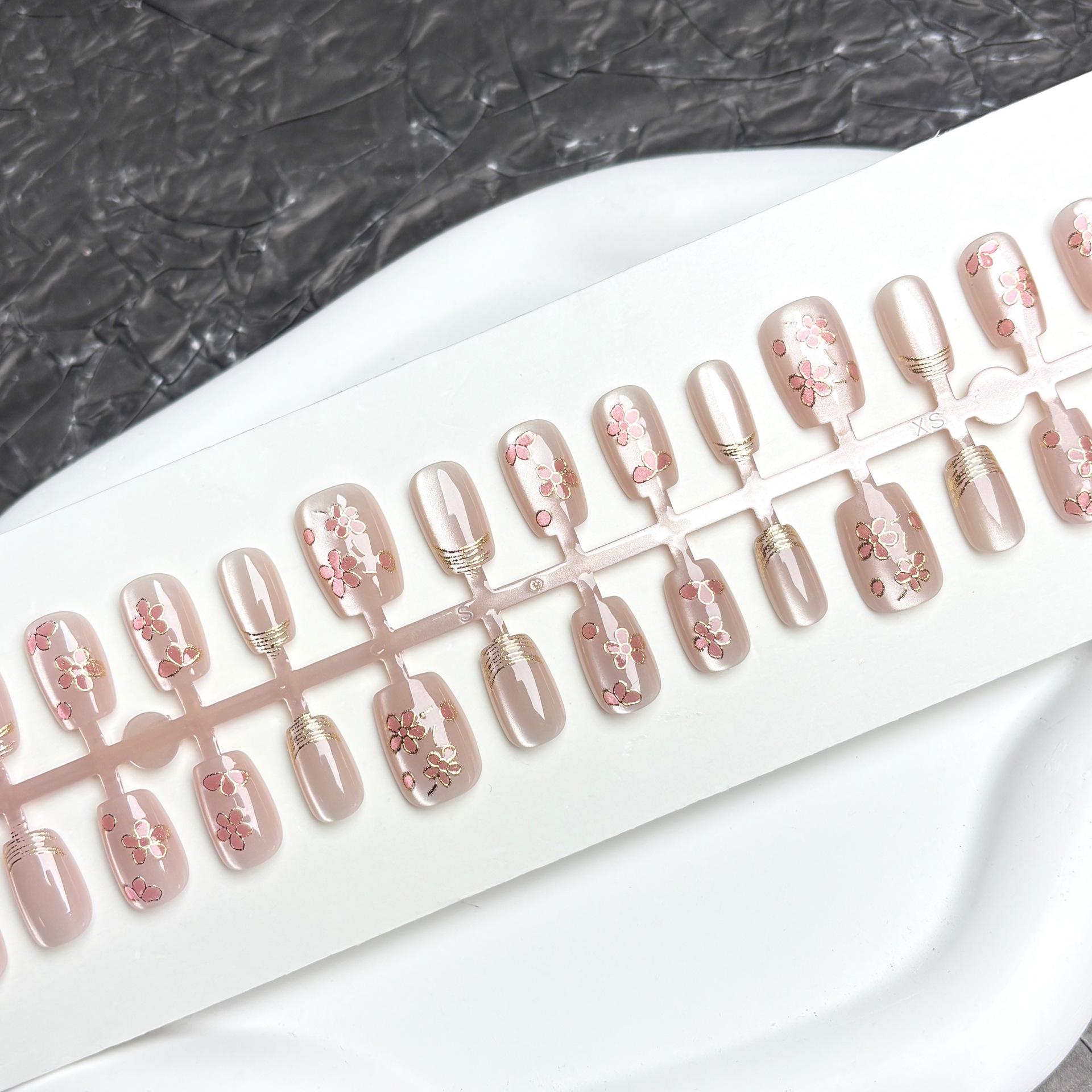 

Exquisite Gilded Cat Eye Nude Nails with Gold French Edge and Floral Design