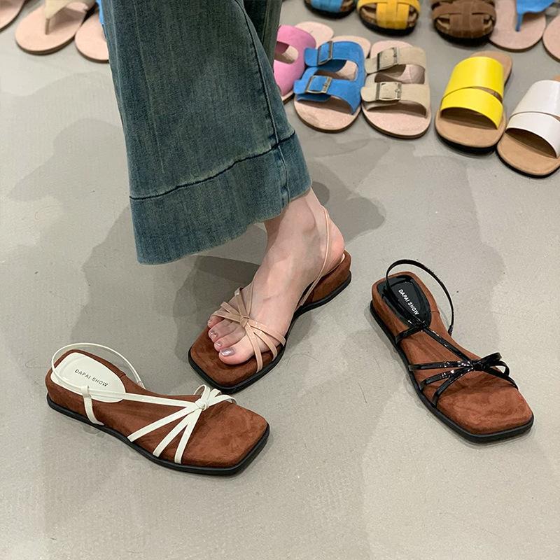 New French slope with skirt women's naked powder outer wear 2025 summer cool heel retro niche temperament thin strap Roman shoes