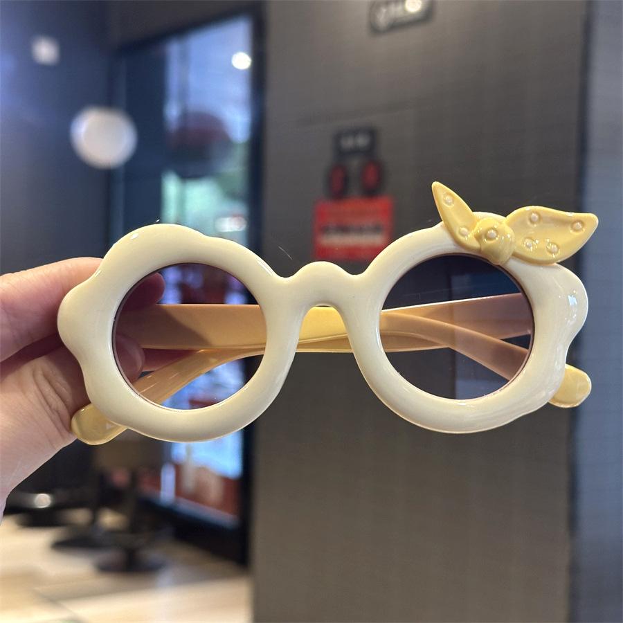 

Kids Sunglasses Cute Flower Shape Bowknot Boys Girls Sun Glasses Round Cartoon Shades Eyewear Outdoor Beach Eye Protection UV400 світло-жовтого кольору