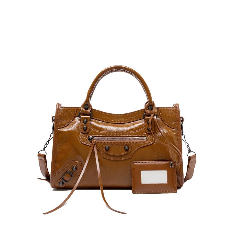Spice girl rivet locomotive bag retro messenger leather large capacity tote bag niche leather handbag women