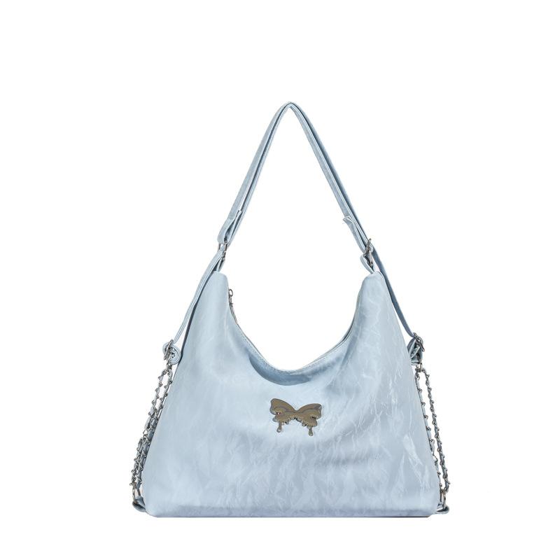 

Casual large-capacity commuter backpack women s 2024 spring new Korean version texture fashion shoulder oblique span bag синій