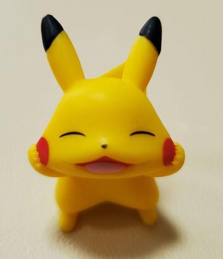 [USED] Pikachu figure smiling