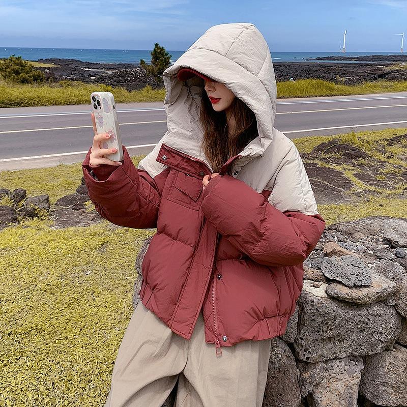 Neuer Winter neue Baumwollkleidung Damen kurz mit Kapuze Splicing Kontrastfarben verdickte Brotkleidung lockerer Mantel trendig