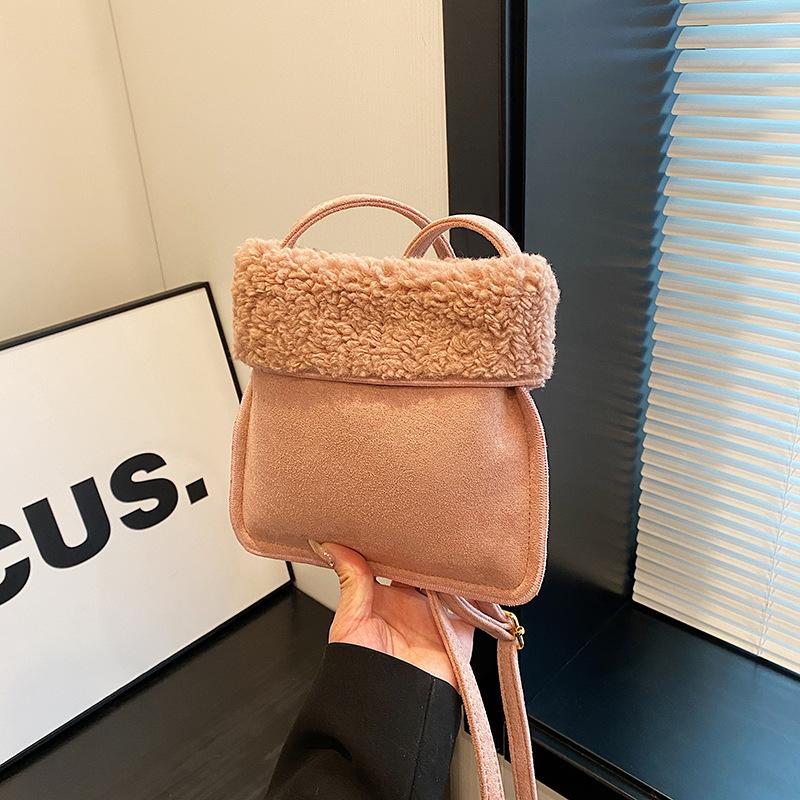 

Women s bag new messenger bag autumn and winter bucket bag niche design matte retro premium shoulder bag рожевий